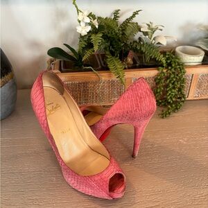 Christian Louboutin, hot pink peep toe snake skin heels.